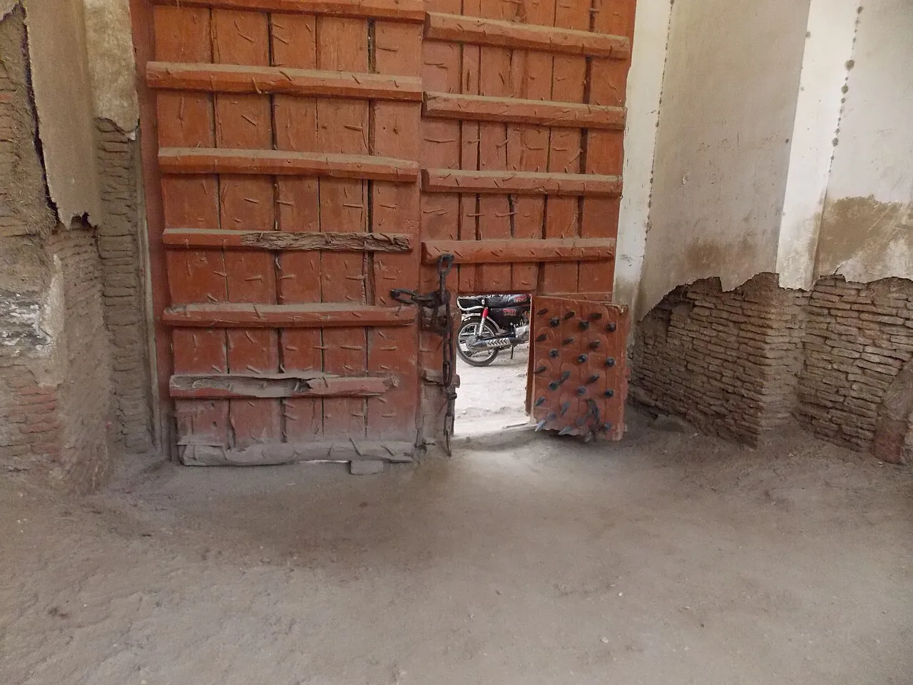 Main entry gate of Kot Diji Fort with iron-spiked wooden doors