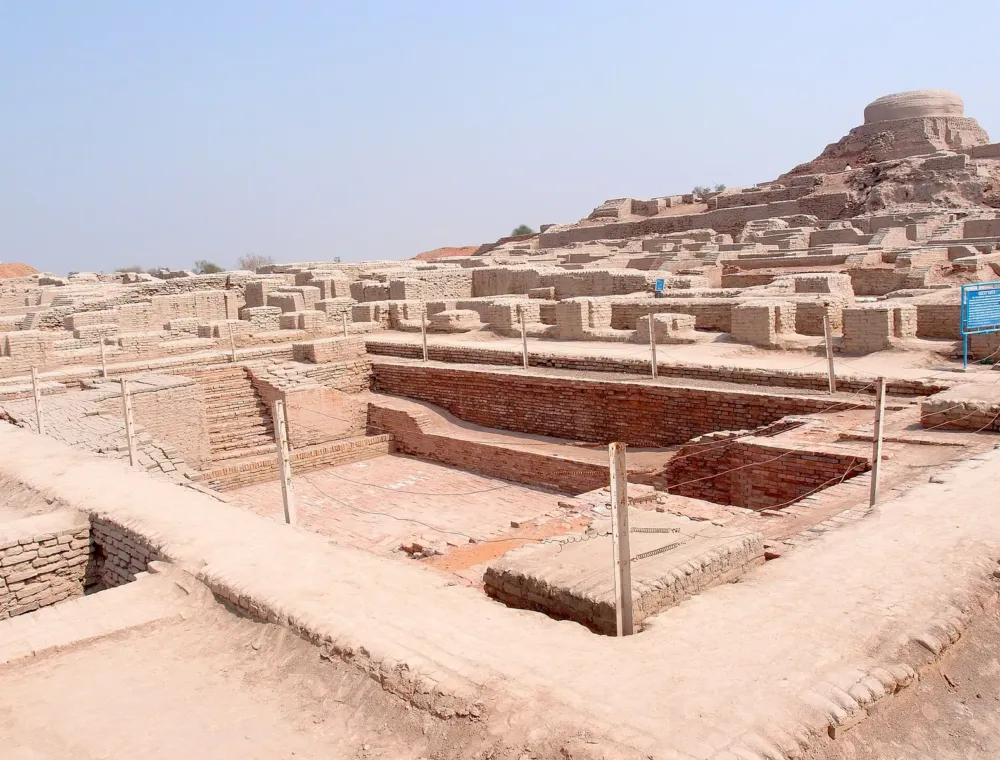 The Great Bath in the foreground with the Great Hall mound behind it on the Citadel at Mohenjo-daro, Larkana