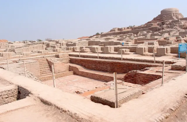 The Great Bath in the foreground with the Great Hall mound behind it on the Citadel at Mohenjo-daro, Larkana