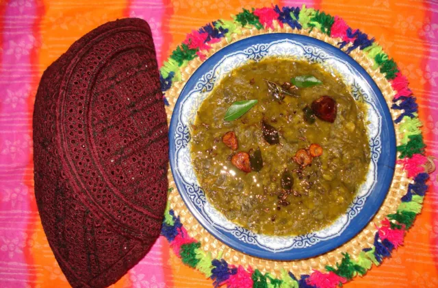 A bowl of Sindhi sai bhaji, mashed spinach, dill and chana daal curry